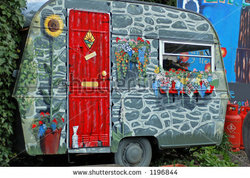 stock-photo-caravan-painted-with-flowers-in-a-yard-1196844.jpg