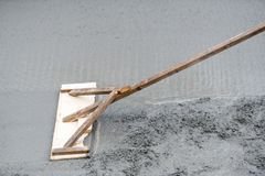worker-leveling-trowel-uneven-fresh-concrete-house-building-detail-construction-site-50442066.jpg